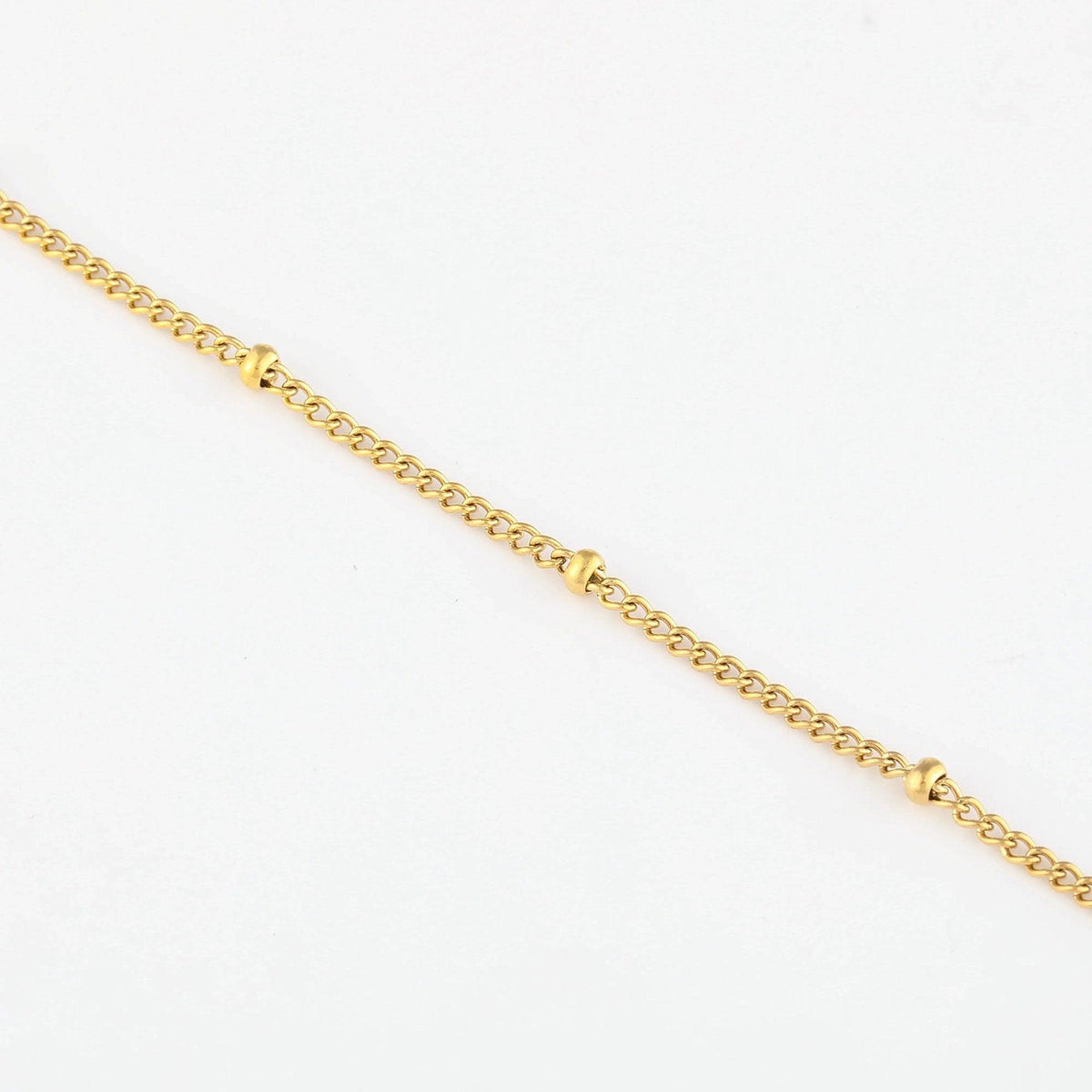 Pulseira de tornozelo com corrente satélite da Wulgor, detalhes delicados em prata para estilo elegante e moderno.